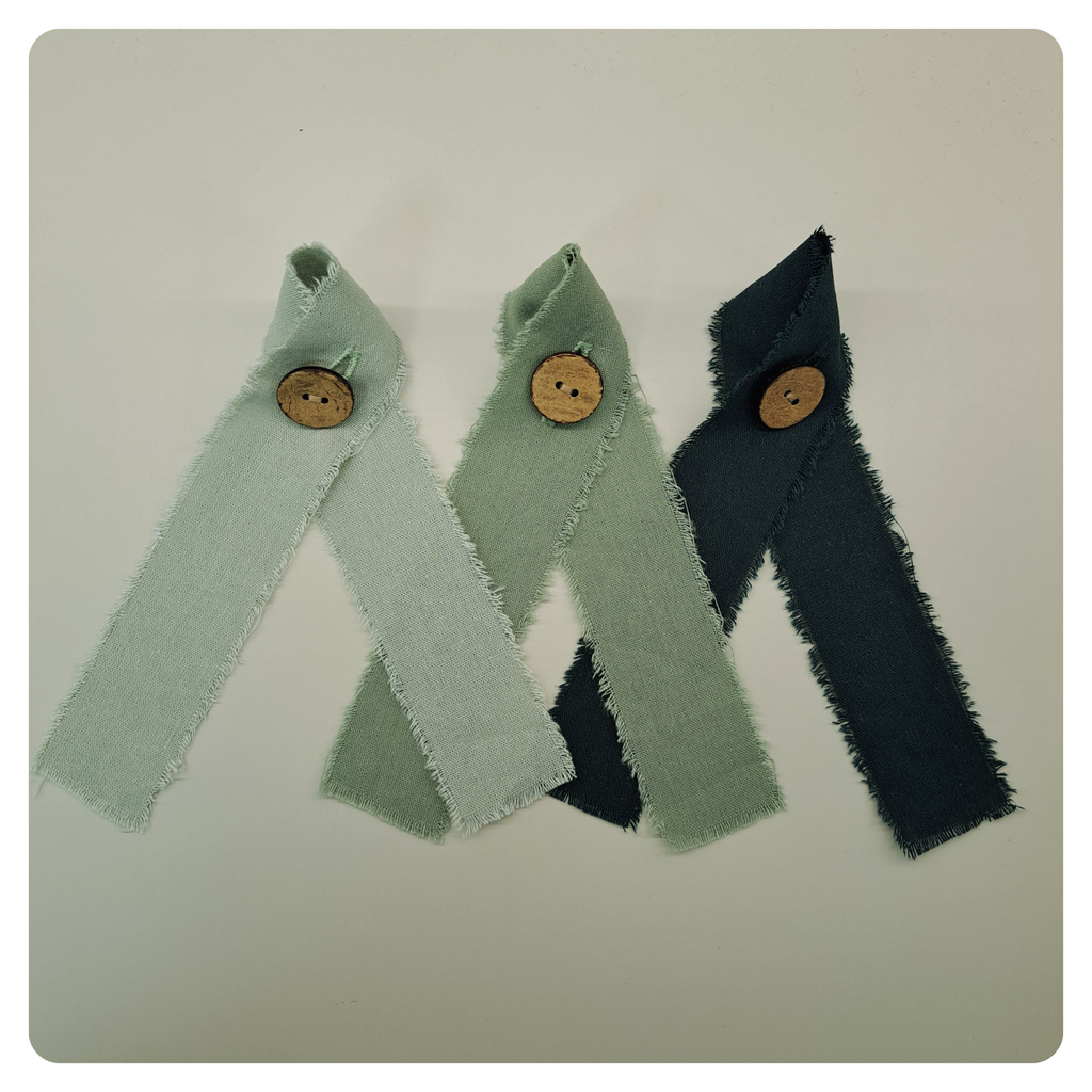 Collection of green decorative glass markers.