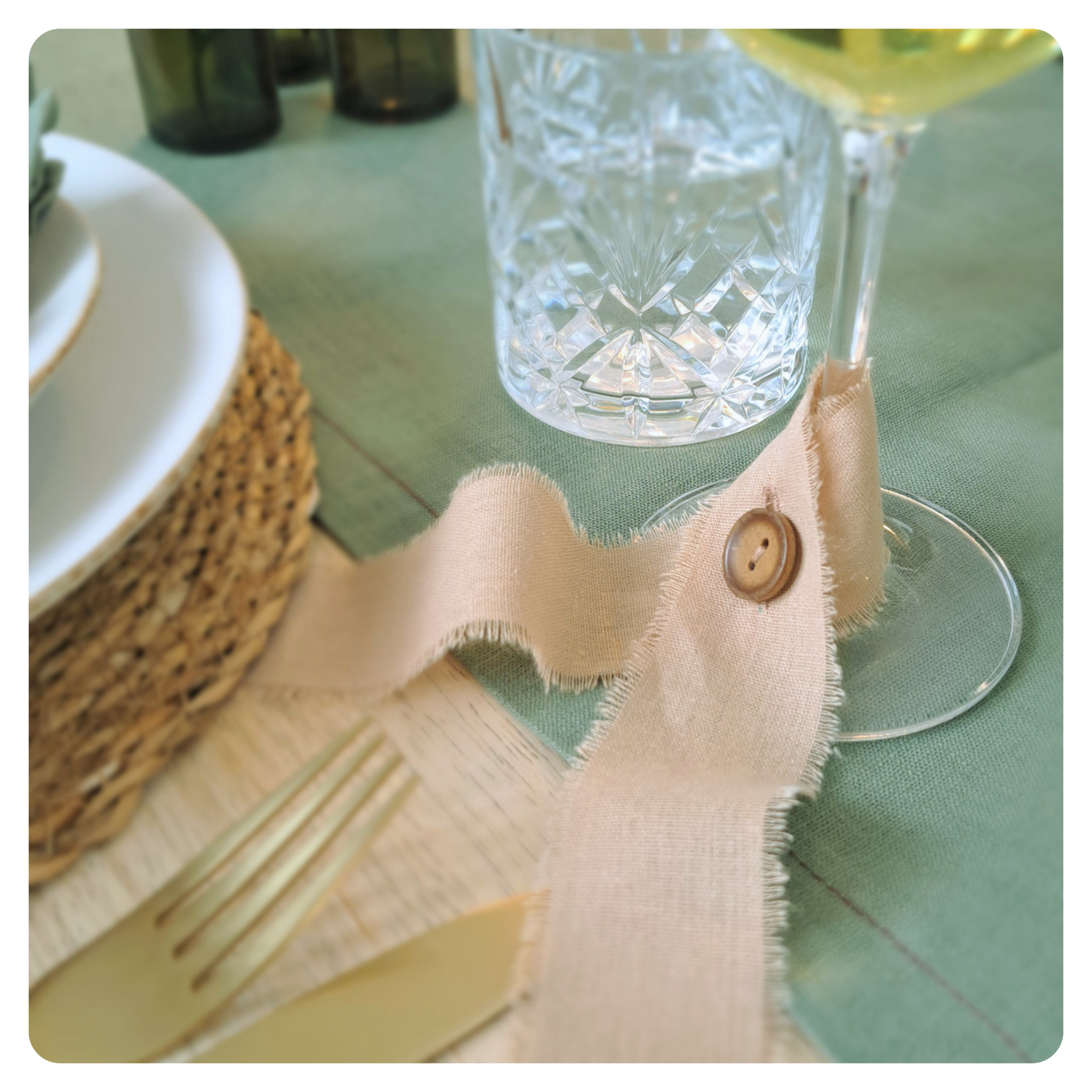 Decorative ribbon glass marker on a table setting
