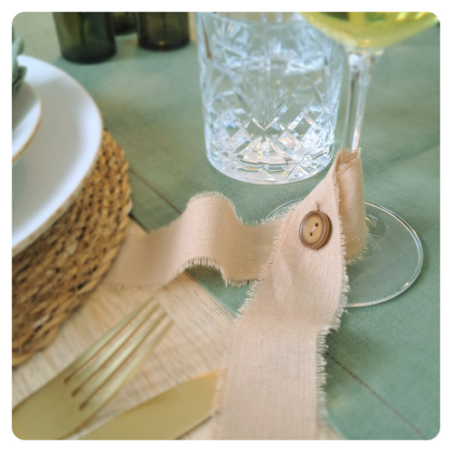 Decorative ribbon glass marker on a table setting