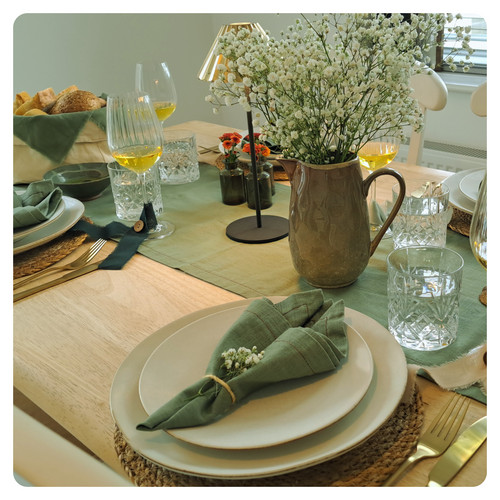 Linen cotton table runner in a dinner setting