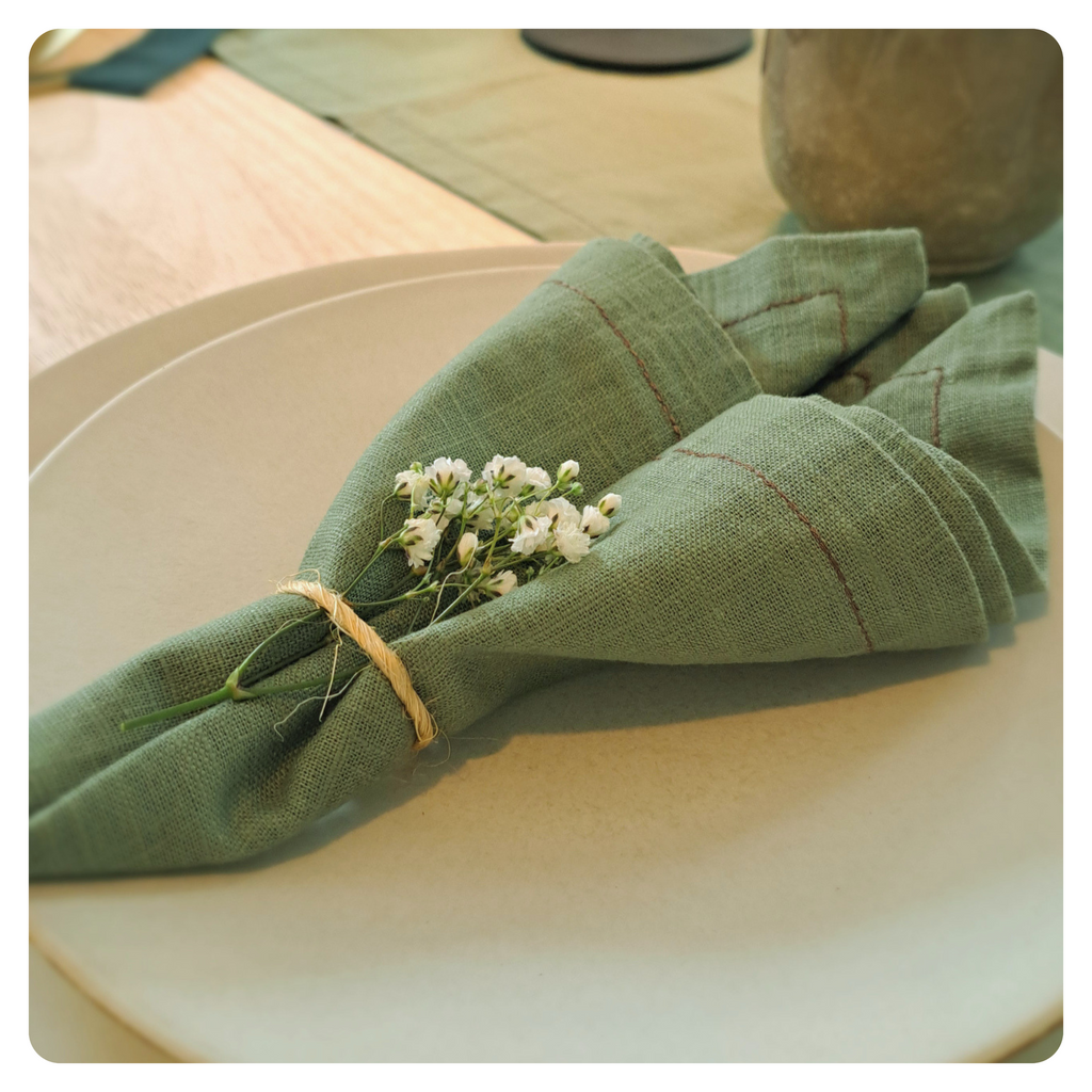 Sage green napkin on place setting